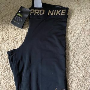 black with gold accent nike pro leggings